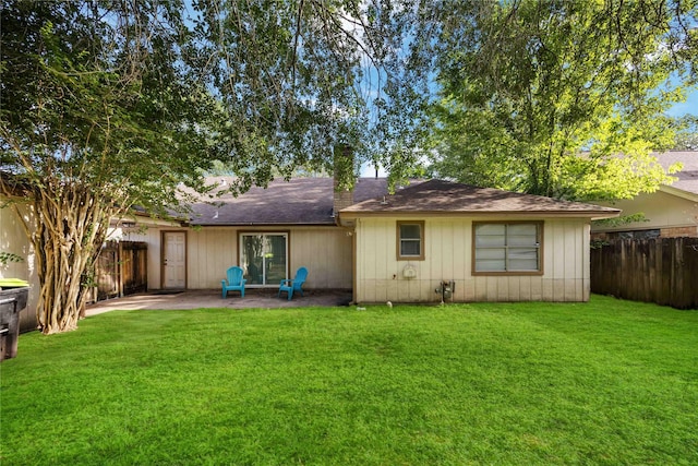 15615 Sandy Hill Dr, Houston, TX 77084 - back of house featuring a fenced backyard, a patio area, a chimney, and roof with shingles