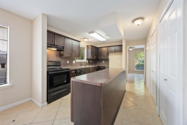 15615 Sandy Hill Dr, Houston, TX 77084 - kitchen with black / electric stove, under cabinet range hood, dark brown cabinets, dishwashing machine, and healthy amount of natural light