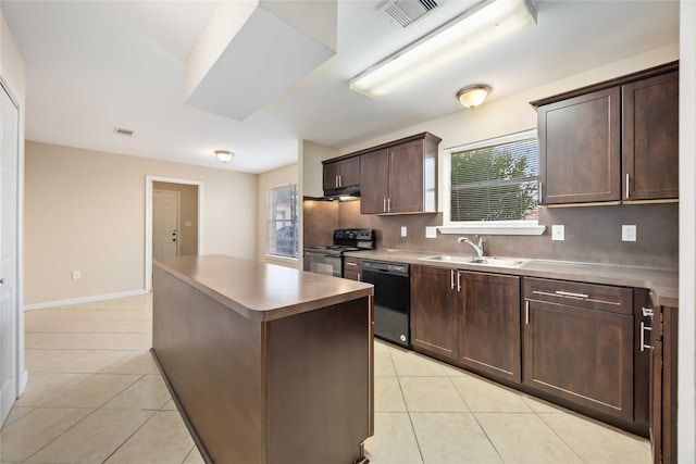 15615 Sandy Hill Dr, Houston, TX 77084 - kitchen featuring black appliances, light tile patterned flooring, a center island, dark brown cabinets, and backsplash