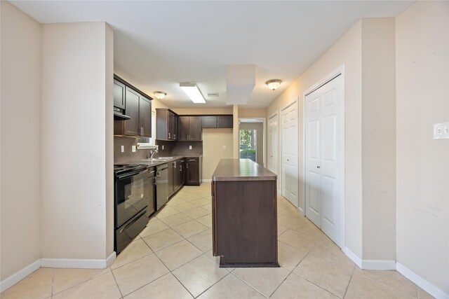 15615 Sandy Hill Dr, Houston, TX 77084 - kitchen featuring black / electric stove, dishwasher, dark brown cabinetry, a kitchen island, and light tile patterned floors