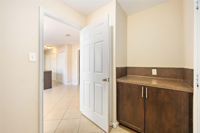 15615 Sandy Hill Dr, Houston, TX 77084 - hall featuring light tile patterned floors and baseboards