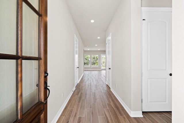 1613 Carefree Cir, Seabrook, TX 77586 - hallway featuring wood finished floors and recessed lighting