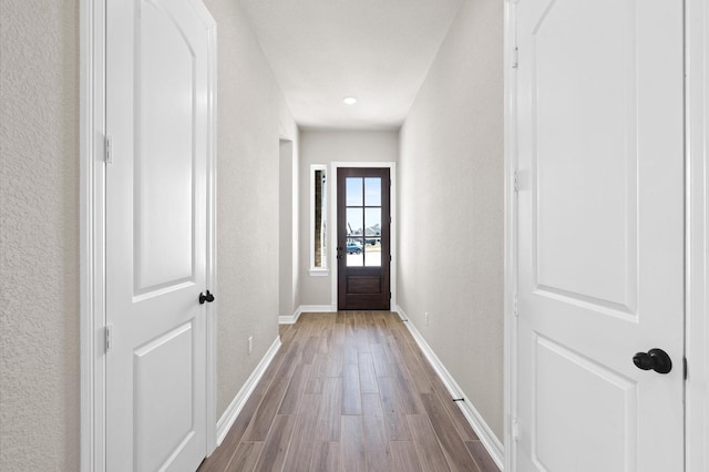 1613 Carefree Cir, Seabrook, TX 77586 - doorway with wood finished floors and a textured wall