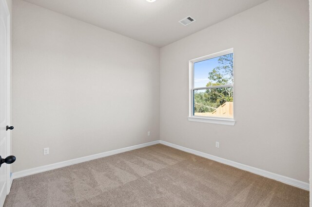 1613 Carefree Cir, Seabrook, TX 77586 - spare room featuring carpet and baseboards
