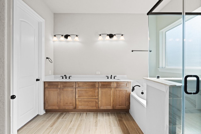 1613 Carefree Cir, Seabrook, TX 77586 - full bathroom featuring a bath, wood finished floors, a shower stall, and double vanity