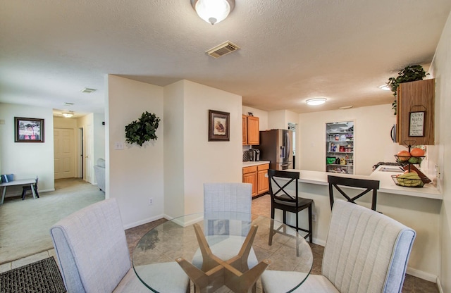 1010 Forestburg Dr, Spring, TX 77386 - dining area with a textured ceiling and baseboards