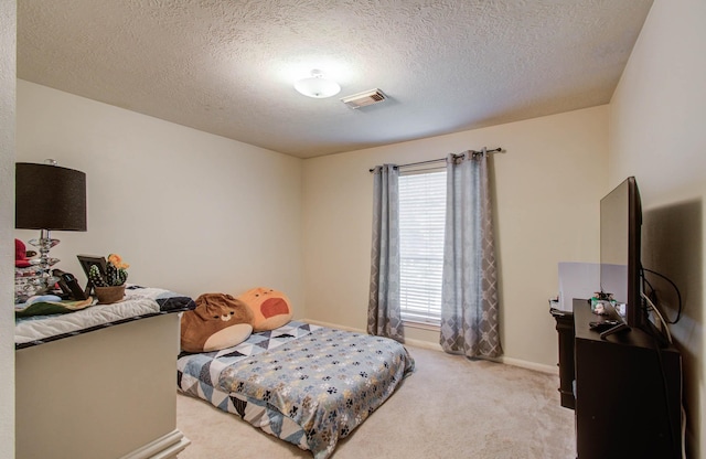 1010 Forestburg Dr, Spring, TX 77386 - bedroom featuring light carpet and a textured ceiling