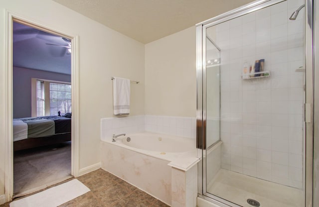 1010 Forestburg Dr, Spring, TX 77386 - ensuite bathroom with a shower stall, a bath, and tile patterned floors