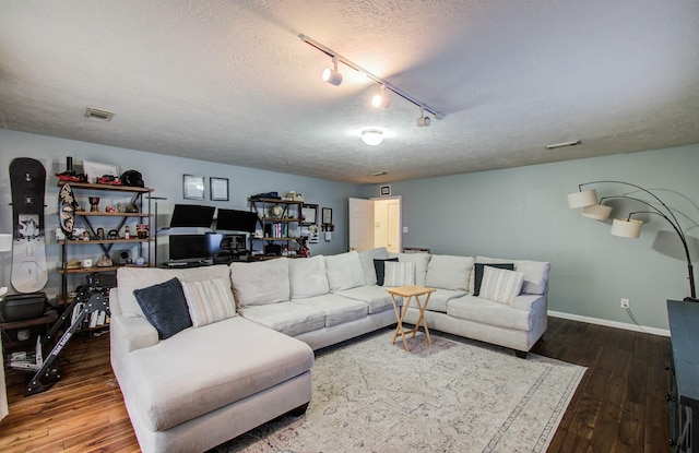 1010 Forestburg Dr, Spring, TX 77386 - living area with a textured ceiling, track lighting, and hardwood / wood-style floors