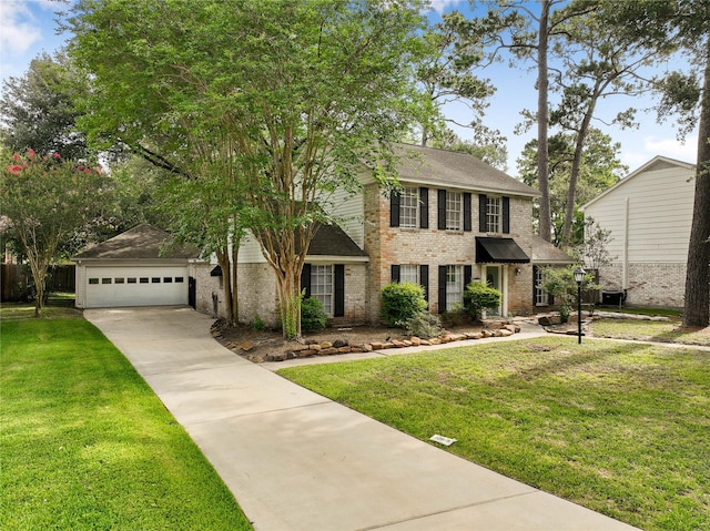 8214 Camborne Ln, Houston, TX 77070 - colonial inspired home with brick siding, a front lawn, driveway, and a shingled roof