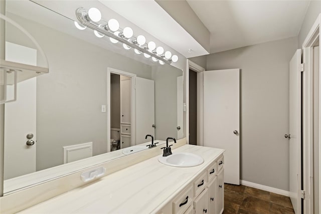8214 Camborne Ln, Houston, TX 77070 - bathroom featuring vanity and stone finish floors