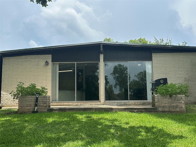 107 Southern Oaks Dr, Lake Jackson, TX 77566 - view of side of home with brick siding and a yard