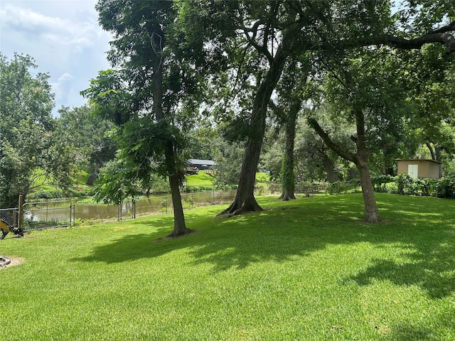 107 Southern Oaks Dr, Lake Jackson, TX 77566 - view of yard with a storage unit