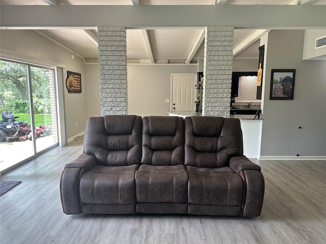 107 Southern Oaks Dr, Lake Jackson, TX 77566 - living area featuring decorative columns, wood finished floors, and beamed ceiling