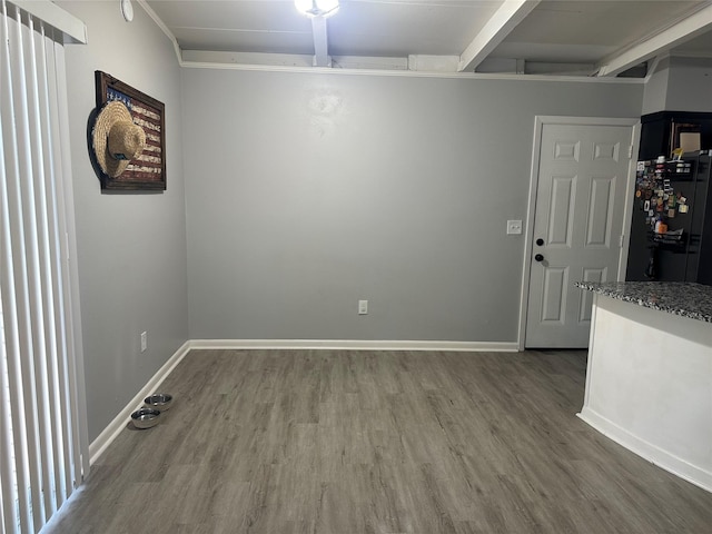 107 Southern Oaks Dr, Lake Jackson, TX 77566 - unfurnished room with wood finished floors and beam ceiling