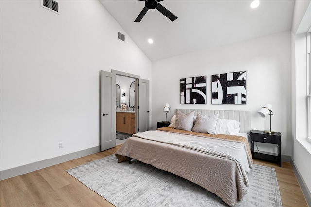 2948 Pitzlin St, Houston, TX 77023 - bedroom with high vaulted ceiling, light wood finished floors, recessed lighting, ensuite bath, and ceiling fan