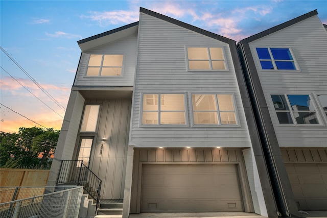2948 Pitzlin St, Houston, TX 77023 - townhome / multi-family property featuring board and batten siding and a garage