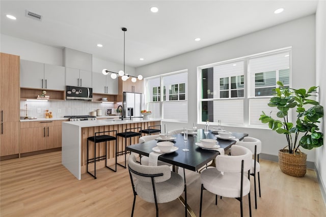 2948 Pitzlin St, Houston, TX 77023 - dining room with light wood-type flooring and recessed lighting