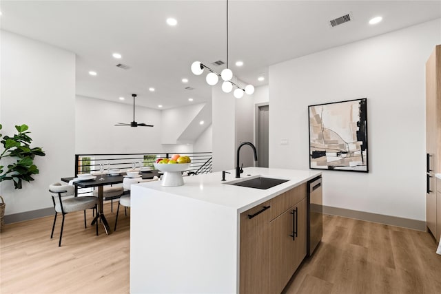 2948 Pitzlin St, Houston, TX 77023 - kitchen with light wood-style flooring, dishwasher, ceiling fan, a center island with sink, and recessed lighting