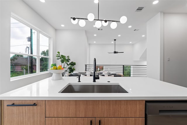 2948 Pitzlin St, Houston, TX 77023 - kitchen with light countertops, recessed lighting, dishwasher, open floor plan, and hanging light fixtures