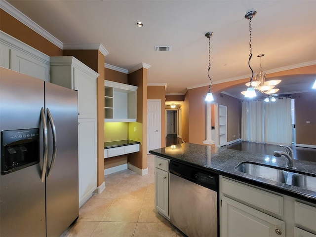 2111 Welch St Unit B109, Houston, TX 77019 - kitchen with appliances with stainless steel finishes, ornamental molding, white cabinetry, decorative light fixtures, and light tile patterned flooring