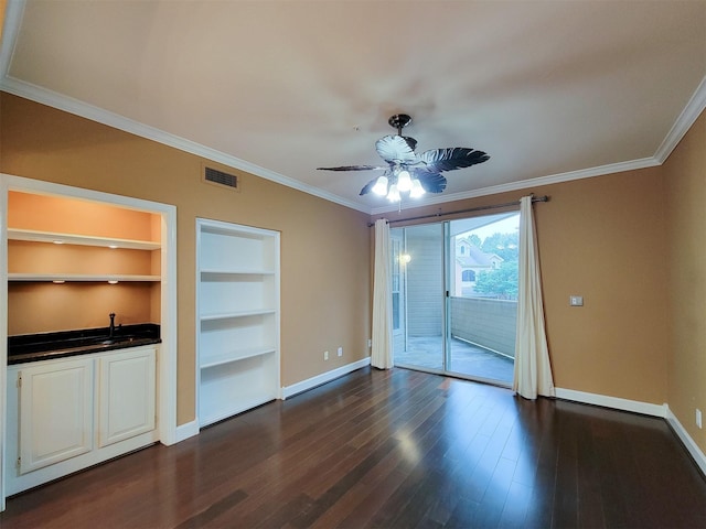 2111 Welch St Unit B109, Houston, TX 77019 - spare room featuring crown molding, dark wood finished floors, built in shelves, and a ceiling fan