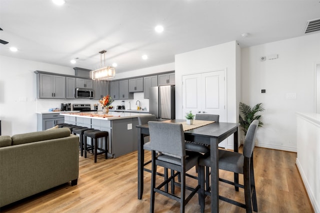 5214 Sherman St, Houston, TX 77011 - dining space with light wood-type flooring and recessed lighting