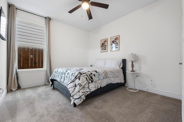 5214 Sherman St, Houston, TX 77011 - carpeted bedroom featuring baseboards and a ceiling fan