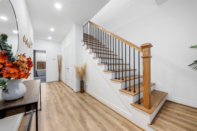 5214 Sherman St, Houston, TX 77011 - stairs with wood finished floors and recessed lighting