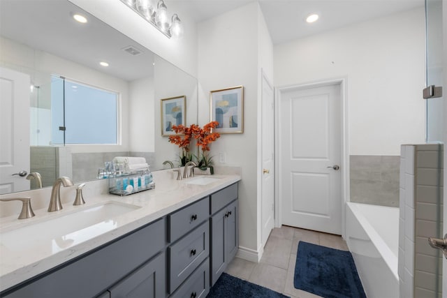 5214 Sherman St, Houston, TX 77011 - full bathroom with tile patterned flooring, double vanity, a garden tub, recessed lighting, and a shower with door