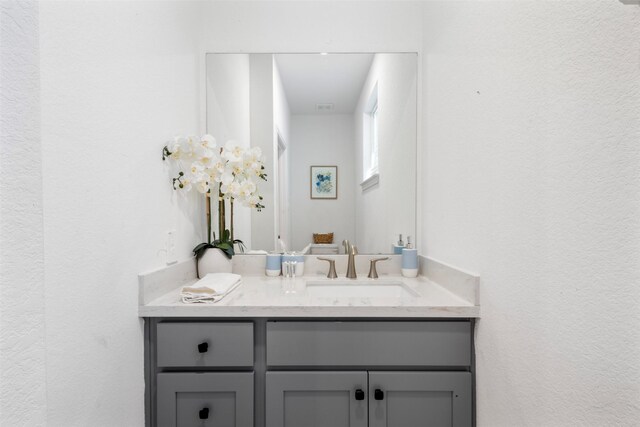 5214 Sherman St, Houston, TX 77011 - bathroom featuring vanity and a textured wall