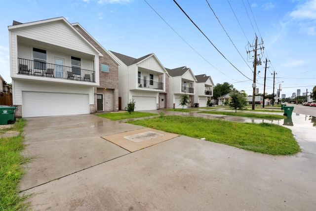 5214 Sherman St, Houston, TX 77011 - view of front of house featuring brick siding, a garage, driveway, a residential view, and board and batten siding