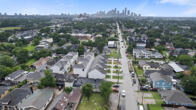 5214 Sherman St, Houston, TX 77011 - aerial view of property and surrounding area with skyline and nearby suburban area