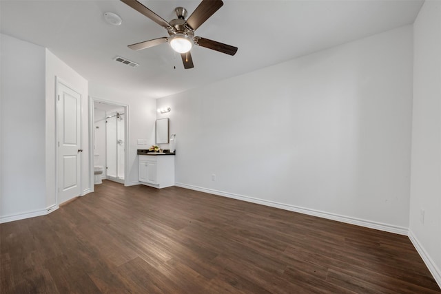 2800 Jeanetta St Unit 1206, Houston, TX 77063 - unfurnished bedroom with dark wood-style flooring, connected bathroom, and a ceiling fan