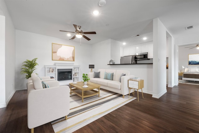 2800 Jeanetta St Unit 1206, Houston, TX 77063 - living area with a ceiling fan, dark wood-style floors, a glass covered fireplace, and recessed lighting