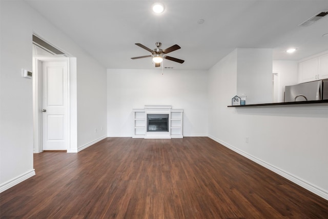 2800 Jeanetta St Unit 1206, Houston, TX 77063 - unfurnished living room featuring a glass covered fireplace, a ceiling fan, dark wood-style floors, and recessed lighting
