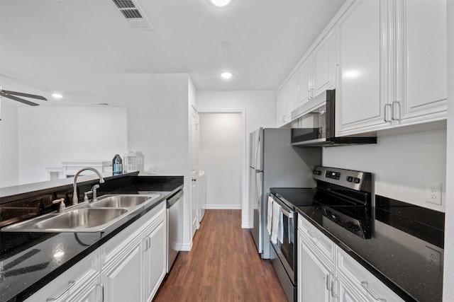 2800 Jeanetta St Unit 1206, Houston, TX 77063 - kitchen with stainless steel appliances, white cabinets, dark wood-style floors, dark stone counters, and recessed lighting