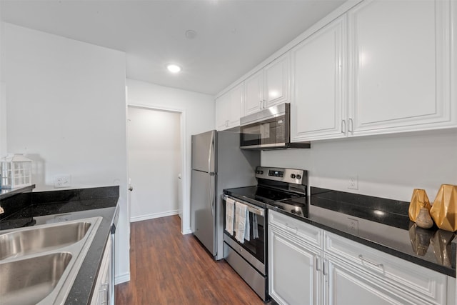 2800 Jeanetta St Unit 1206, Houston, TX 77063 - kitchen featuring stainless steel appliances, white cabinetry, dark wood-type flooring, dark stone countertops, and recessed lighting