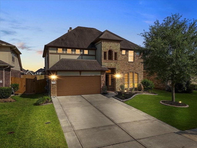 2424 Santiago Ln, League City, TX 77573 - view of front facade with driveway, brick siding, and a garage