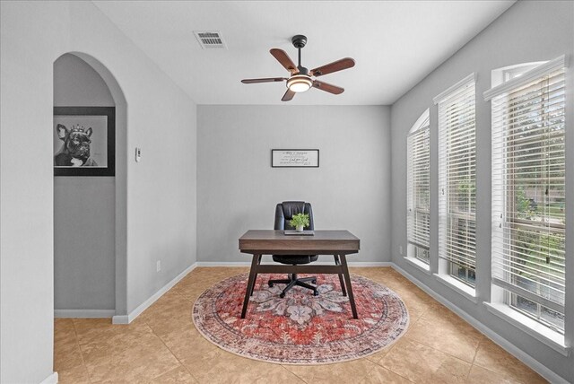 2424 Santiago Ln, League City, TX 77573 - office space featuring a ceiling fan, tile patterned floors, and arched walkways