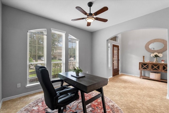 2424 Santiago Ln, League City, TX 77573 - office area featuring arched walkways, a ceiling fan, and light tile patterned flooring