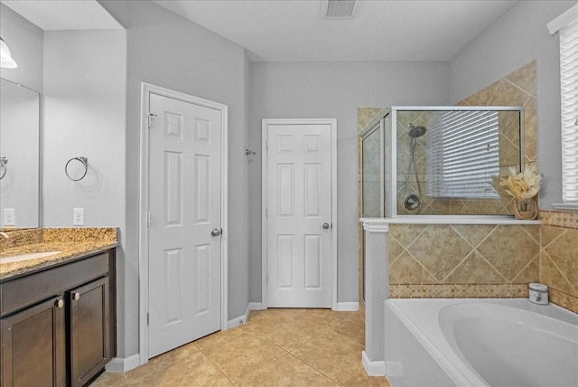 2424 Santiago Ln, League City, TX 77573 - bathroom with a bath, a stall shower, tile patterned flooring, and vanity