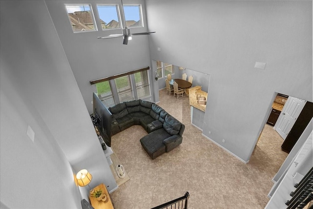 2424 Santiago Ln, League City, TX 77573 - living room featuring a high ceiling and baseboards