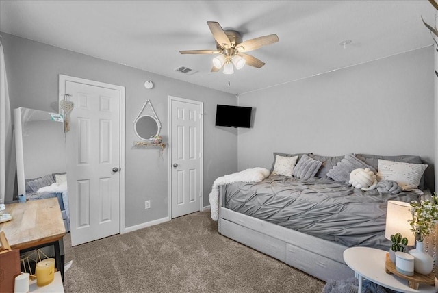 2424 Santiago Ln, League City, TX 77573 - carpeted bedroom with baseboards and ceiling fan