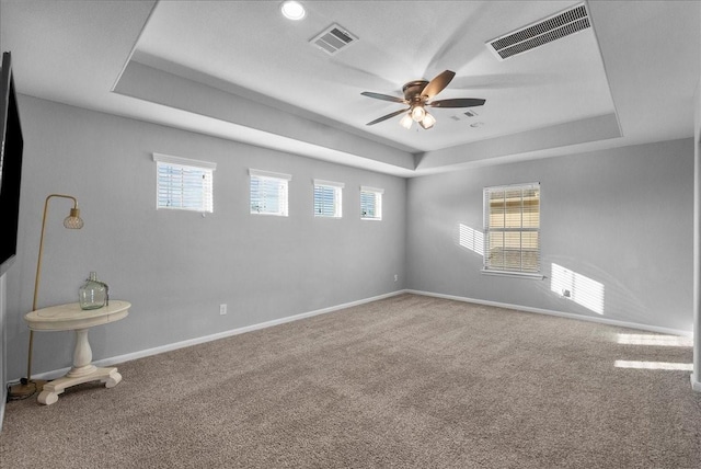 2424 Santiago Ln, League City, TX 77573 - carpeted spare room with a raised ceiling, healthy amount of natural light, and ceiling fan