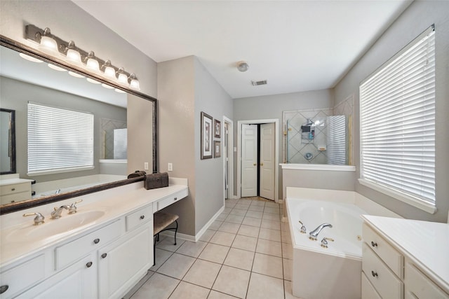 6027 Stone Trail Ln, Spring, TX 77379 - bathroom with a tub with jets, vanity, tile patterned floors, and a tile shower