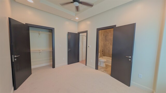 1844 Colquitt St, Houston, TX 77098 - unfurnished bedroom with recessed lighting, a ceiling fan, connected bathroom, multiple closets, and carpet floors