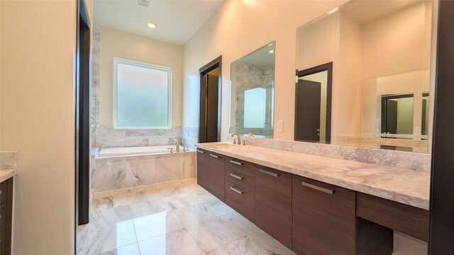 1844 Colquitt St, Houston, TX 77098 - full bathroom with vanity, a garden tub, and marble finish floors