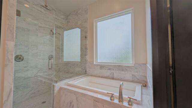 1844 Colquitt St, Houston, TX 77098 - full bathroom featuring a bath and a marble finish shower