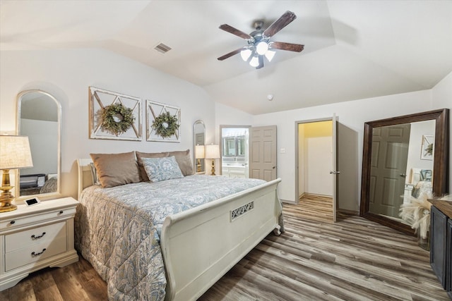 2826 Lakecrest Forest Dr, Katy, TX 77493 - bedroom featuring vaulted ceiling, wood finished floors, a ceiling fan, and ensuite bath